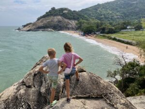 Children enjoying the view over Sai Noi Beach in Hua Hin with kids on a family adventure in Thailand